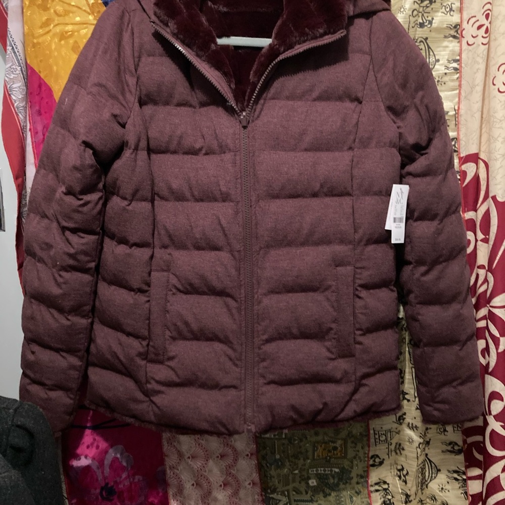 Purple reversible faux fur with pockets on both sides. New never worn. Very cozy